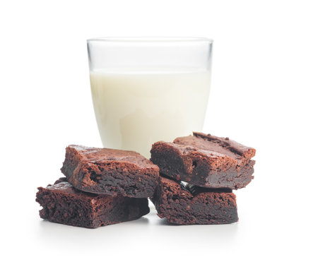 Homemade chocolate brownies and milk in glass isolated on a white background.の写真素材