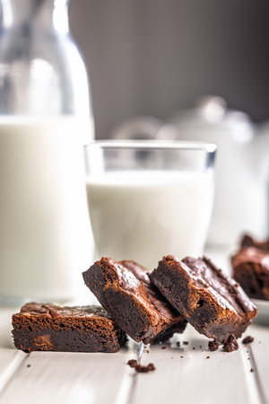 Homemade chocolate brownies on a white table.の写真素材