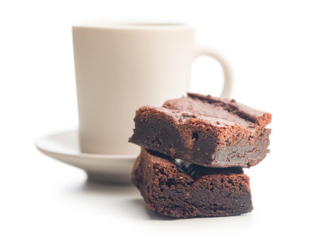 Homemade chocolate brownies and coffee cup isolated on a white background.の写真素材