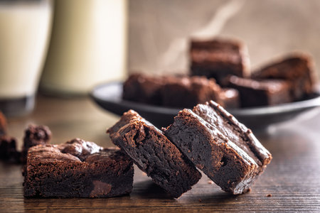 Homemade chocolate brownies on a wooden table.の写真素材