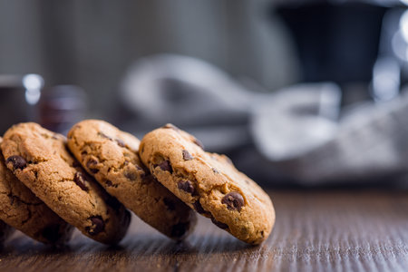 Chocolate chip cookies on a wooden table.