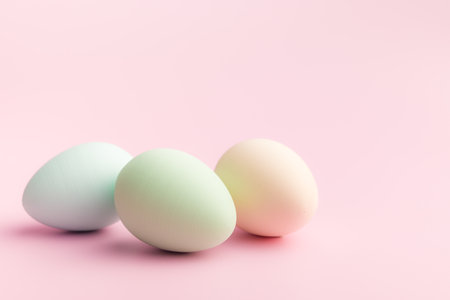 Easter decorations. Colorful eggs on a pink background.の写真素材
