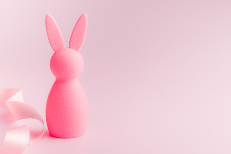 Easter decorations. Colorful bunny on a pink background.の写真素材