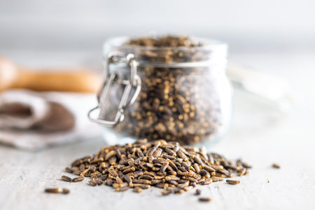 Milk thistle seeds on a kitchen table.の写真素材