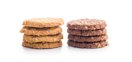 Sweet oatmeal cookies isolated on a white background.の写真素材