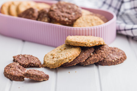 Sweet oatmeal cookies on a white table.の写真素材