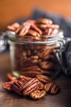 Peeled pecan nuts on a wooden table.