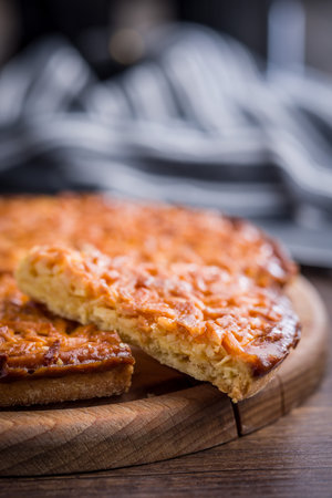 Sweet almond pie on a wooden table.の写真素材