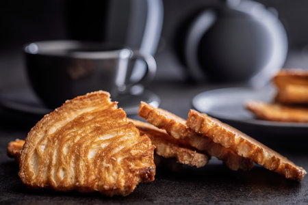 Crispy sweet pastry on a black table.の写真素材