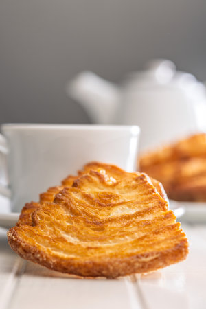 Le sfoglie. Crispy sweet pastry on a white table.の写真素材