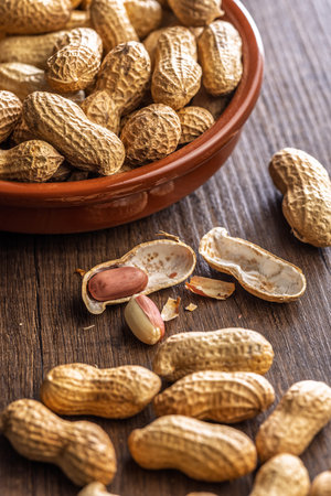 Peanuts in shell. Groundnuts on a wooden table.