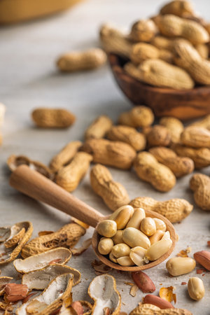 Peanuts in shell. Groundnuts on a kitchen table.の写真素材