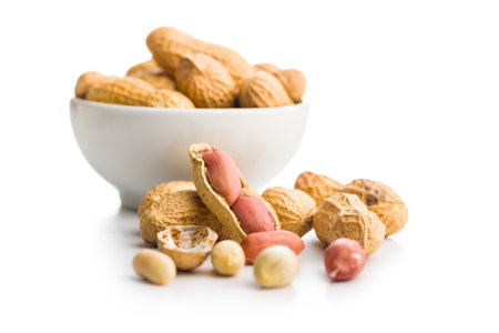 Peanuts in shell. Groundnuts isolated on a white background.
