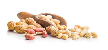 Peanuts in shell. Groundnuts in a scoop isolated on a white background.
