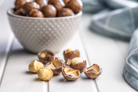 Tasty macadamia nuts on a white table.の写真素材
