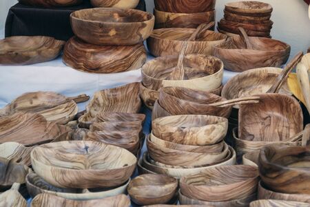 Medieval market stall of handmade wooden utensils. craft market