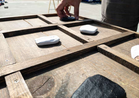 tic-tac-toe game made with wood and stonesの写真素材