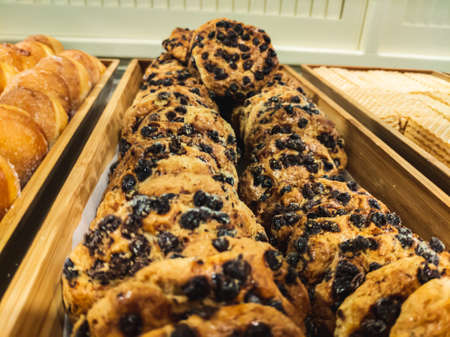 Close-up of chocolate chip cookies in old wooden boxesの写真素材