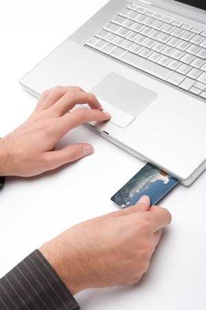 Laptop with credit card plug-in for electronic paymentの写真素材