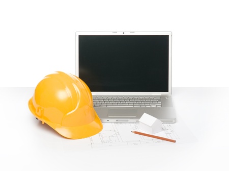 Blueprint of architecture, protective helmet and laptopの写真素材