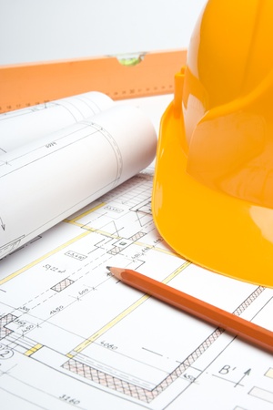 Blueprints of architecture interior, pencil, protective helmet and bubble levelの写真素材
