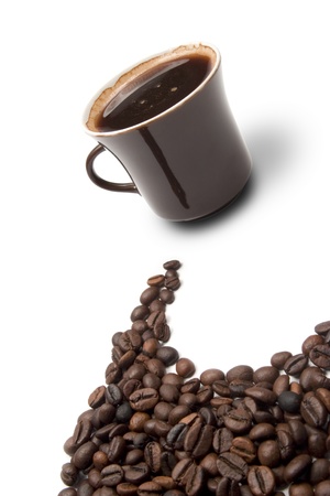 Closeup cup and coffee beans on white background - dynamic compositionの写真素材