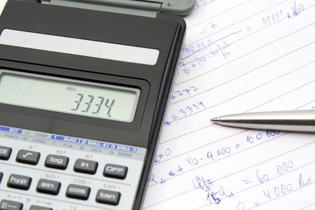 Student calculate economical example - calculator, pen, commonplace book
