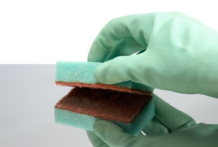 Hand with rubber glove cleaning