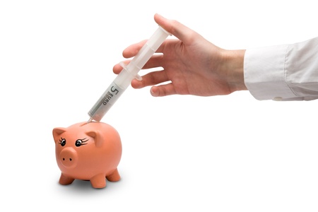 Financial injection in piggy bank (political solving the financial crisis)の写真素材