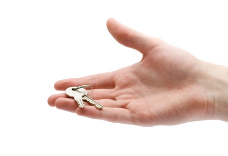 Estate agency - hand give key to housingの写真素材