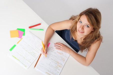 College student studying (swot up) for exam. Focused on face. Top view.
の写真素材