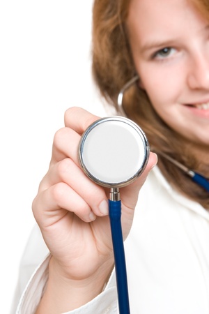 Medical concept - young woman doctor with stethoscope, selective focusの写真素材