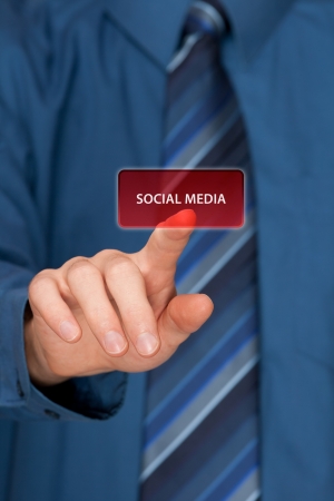 Social media concept  Mans hand click on social media button ahead  Selective focused hand の写真素材