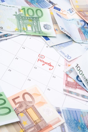 Payday concept - calendar wit text payday and money.
の写真素材
