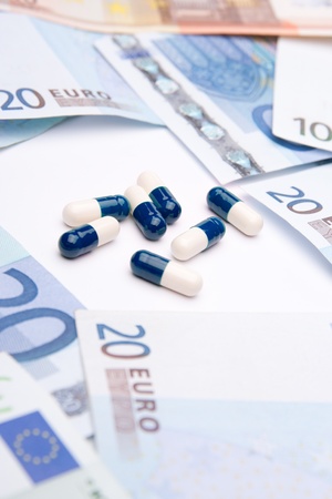 Buy health concept - drugs and money. Medicine and healthcare is a business.の写真素材