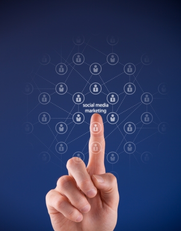 Social media marketing concept - man click on text "social media marketing" and network of people relationships.の写真素材
