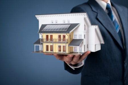 Real estate agent offer house represented by model の写真素材
