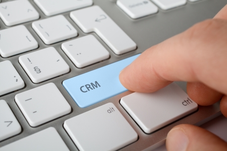 CRM  customer relationship management  concept  Man press CRM key on computer keyboard  の写真素材