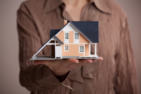 Real estate agent offer house represented by model の写真素材
