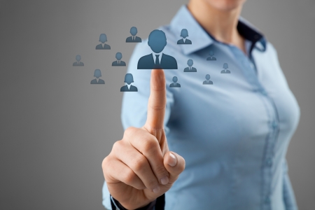 Human resources, CRM and social networking concept - female officer choose person  employee  represented by icon の写真素材
