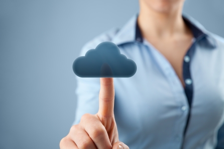 Cloud computing concept  Woman click on cloud icon ahead  Selective focused on finger and cloud  の写真素材