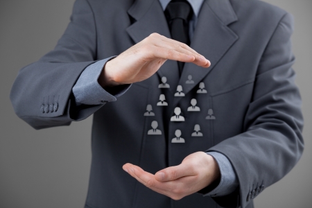 Customer care, care for employees, labor union, life insurance and marketing segmentation concepts. Protecting gesture of businessman or personnel and icons representing group of people.
の写真素材