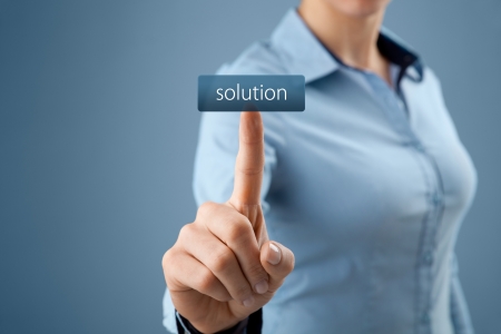 Get solution concept. Businesswoman click on virtual button with text solution (look for easy solutions).の写真素材