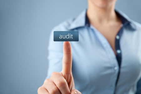 Woman click on button audit. Businesswoman order company audit.
の写真素材