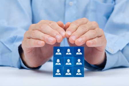 Customer care, care for employees, labor union, CRM, and life insurance concepts  Protecting gesture of businessman or personnel and glass cubes with icons representing group of people  の写真素材