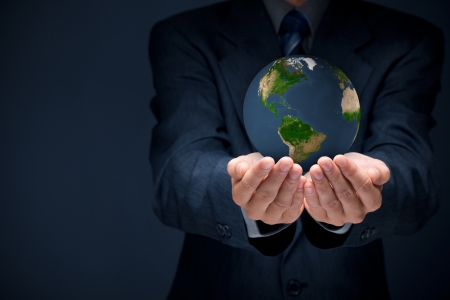 Businessman protecting the Earth  sustainable responsible  eco-friendly  business and global business concepts  Move heaven and earth idiom  Source map by NASA  の写真素材