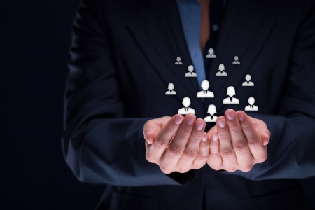 Customer care, care for employees, labor union, CRM, and life insurance concepts. Protecting gesture of businesswoman or personnel with icons representing group of people.の写真素材