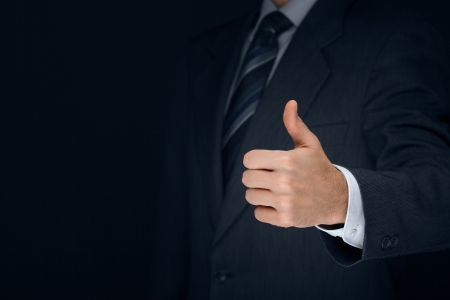 Nonverbal communication. Like, OK, perfect, good job, praise, satisfied, thumb up gesture of businessman.
の写真素材