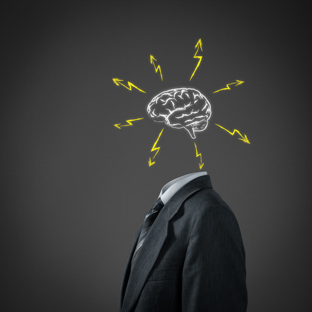 Businessman without head just with sketched brain and flashes の写真素材