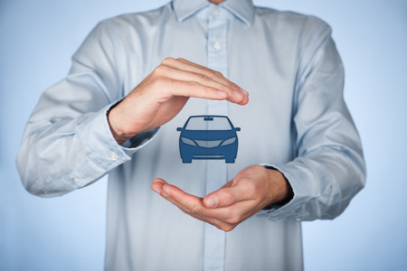 Businessman with protective gesture and icon of car.の写真素材